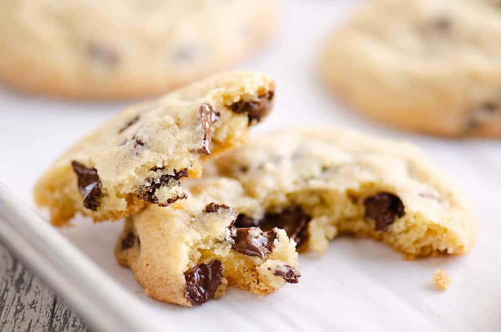 Chocolate Chip Cookie broken in half on cookie sheet