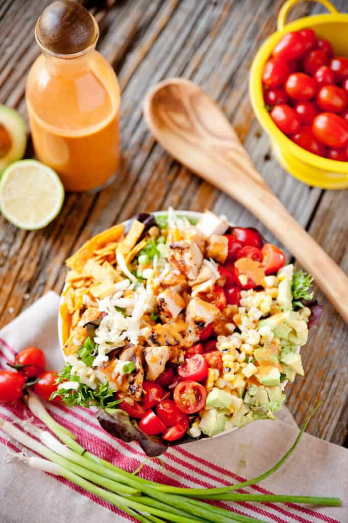 southwest cobb salad on table with napkin and vegetables
