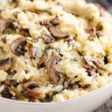 Pressure Cooker Mushroom Risotto in bowl with mushrooms and thyme