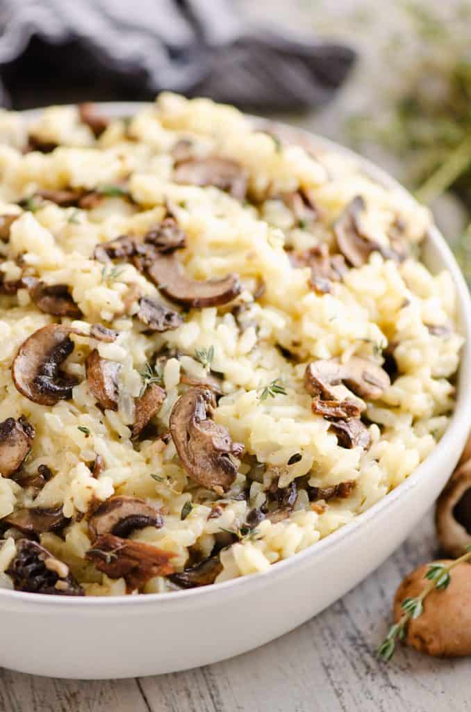 Pressure Cooker Mushroom Risotto in bowl with mushrooms and thyme