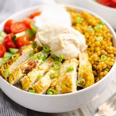 Pressure Cooker Chicken Schwarma Couscous Bowls on table with lemon