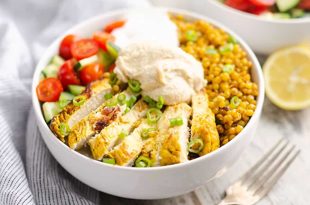 Pressure Cooker Chicken Schwarma Couscous Bowls on table with lemon