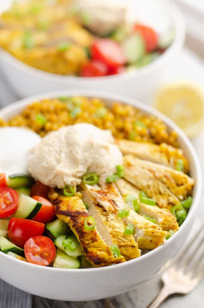 Pressure Cooker Chicken Schwarma Couscous Bowls on table with fork