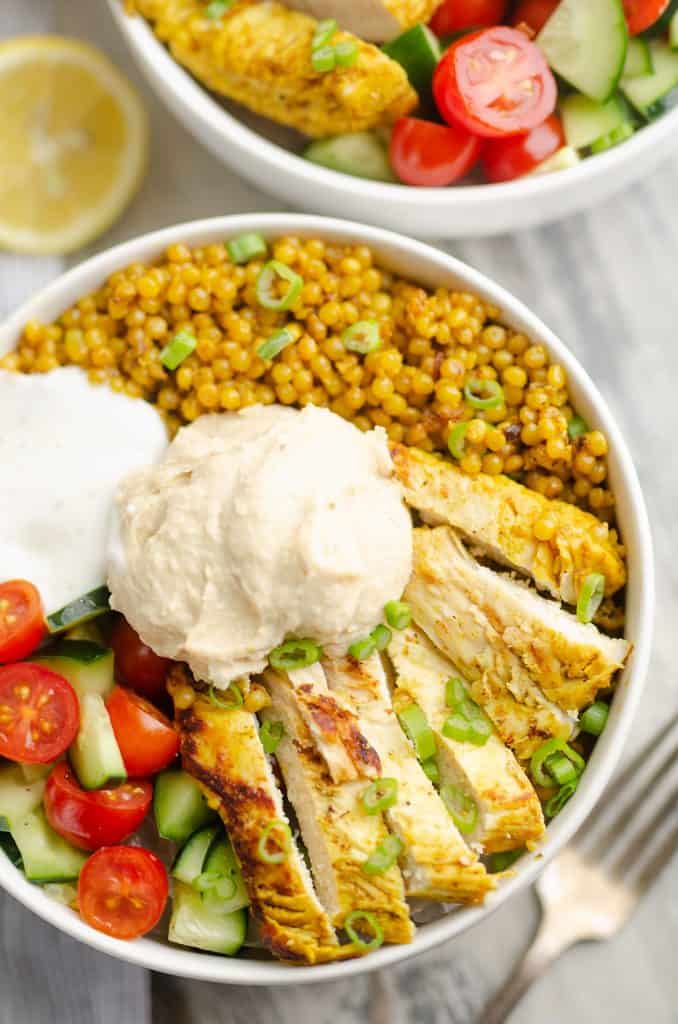 Pressure Cooker Chicken Schwarma Couscous Bowls on table with fork