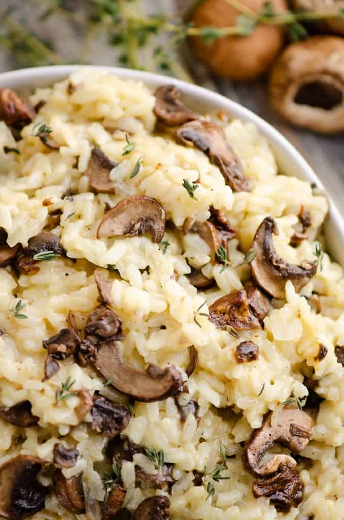 Pressure Cooker Mushroom Risotto in bowl with mushrooms and thyme