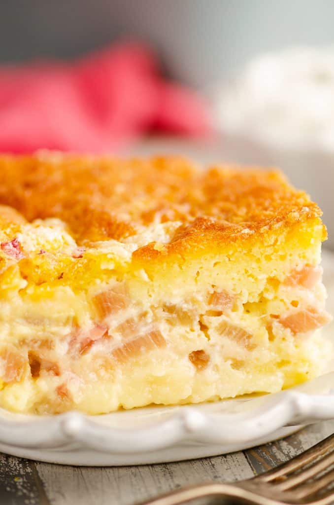 Rhubarb Custard Cake on white plate with fork