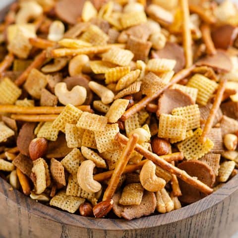 Buttery snack mix in large wooden bowl