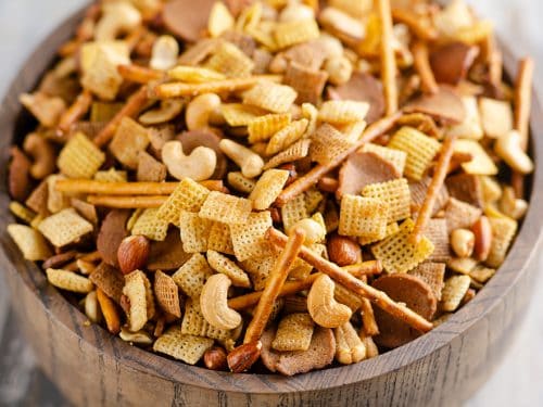 Buttery snack mix in large wooden bowl