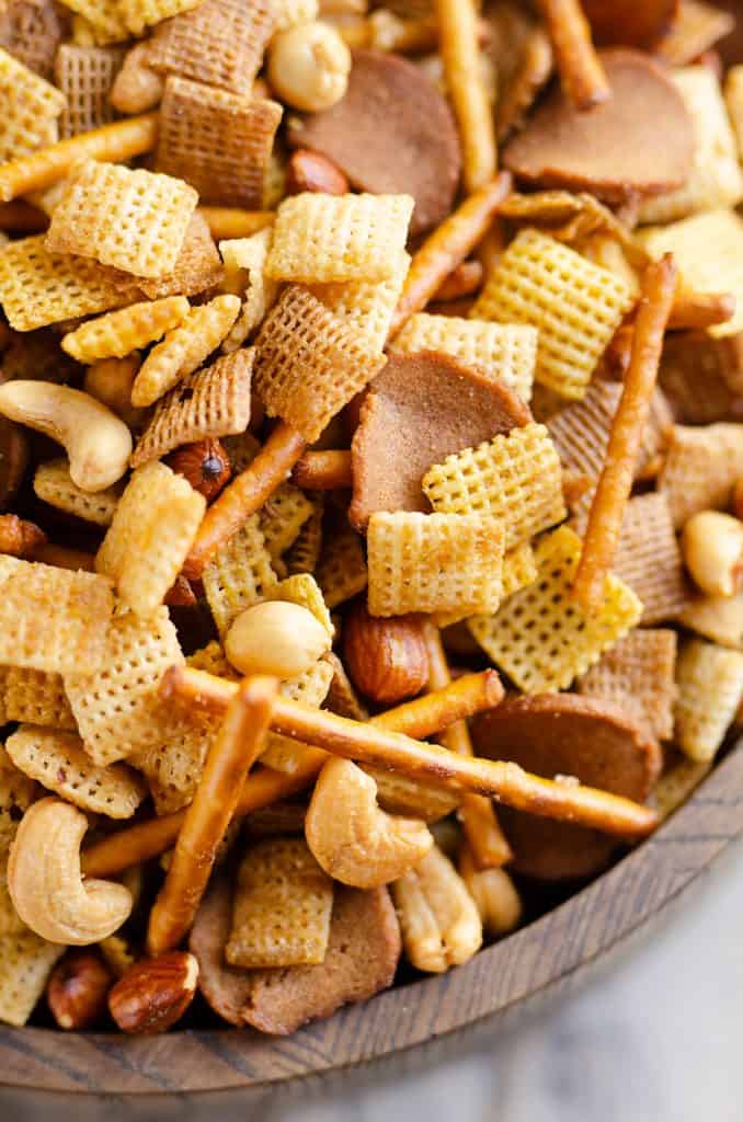 buttery snack mix in bowl with Chex Mix, nuts, pretzels and rye chips