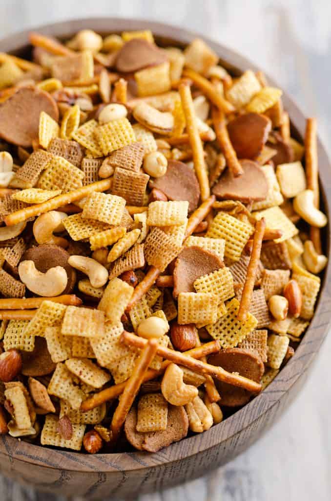 Buttery snack mix in large wooden bowl