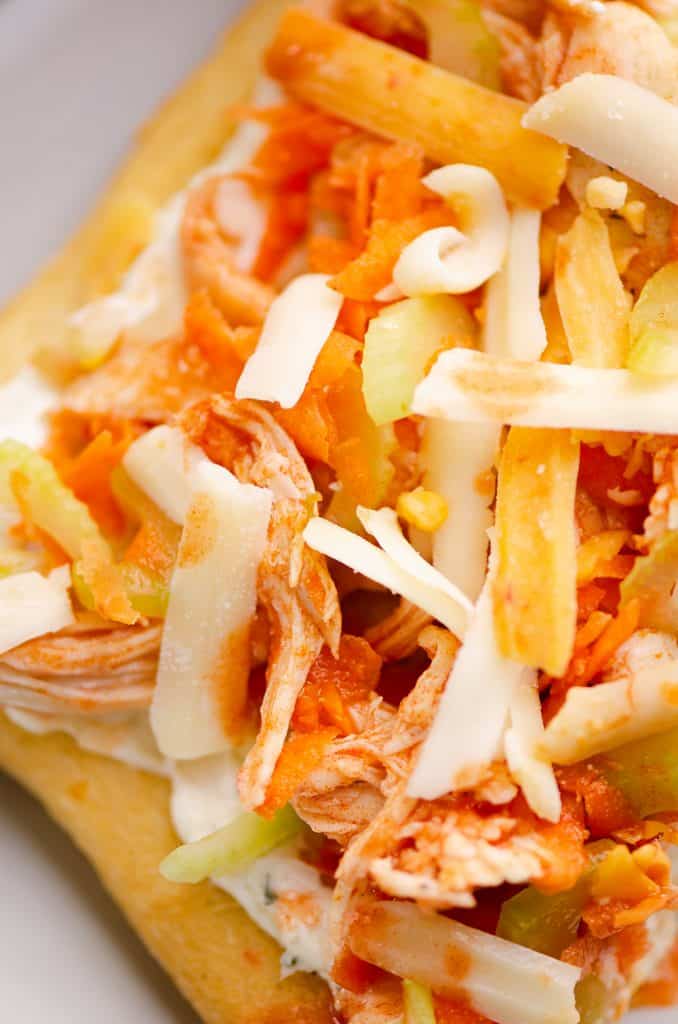 Buffalo Chicken Vegetable Pizza topped with shredded cheese