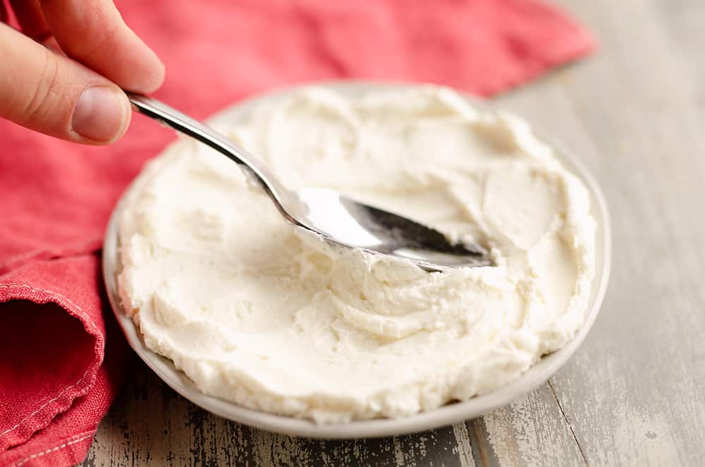 Whipped Goat Cheese spread on small plate with spoon
