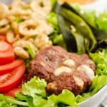 Smoked Cheese Curd Burger Salad on table with chipotle dressing