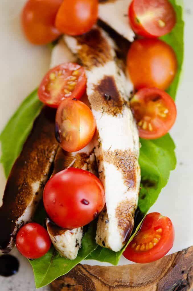 balsamic chicken, tomatoes and basil layered on mozzarella cheese wrap