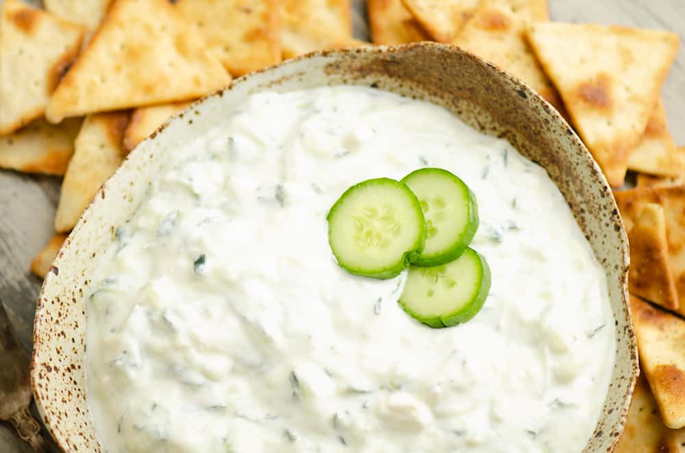 Cucumber Feta Greek Yogurt Dip topped with small slices of cucumber
