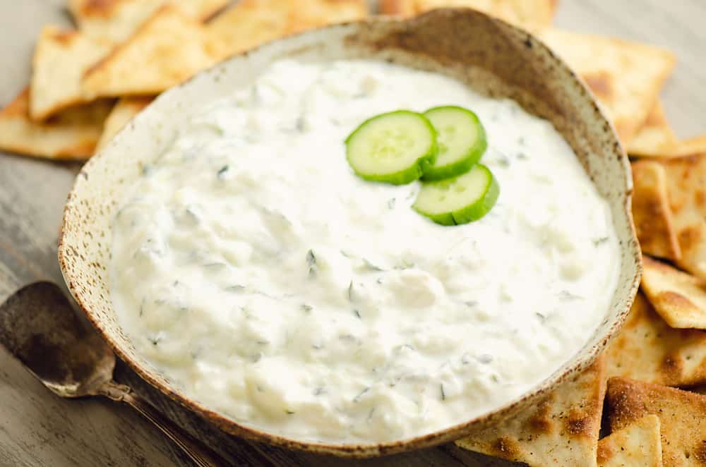 Cucumber Feta Greek Yogurt Dip in homemade bowl with pita chips