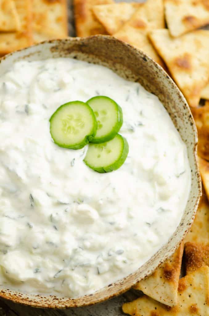 Cucumber Feta Greek Yogurt Dip in bowl topped with cucumber slices