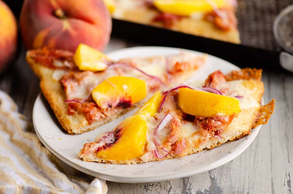 slice of BBQ Peach Pizza on white plate