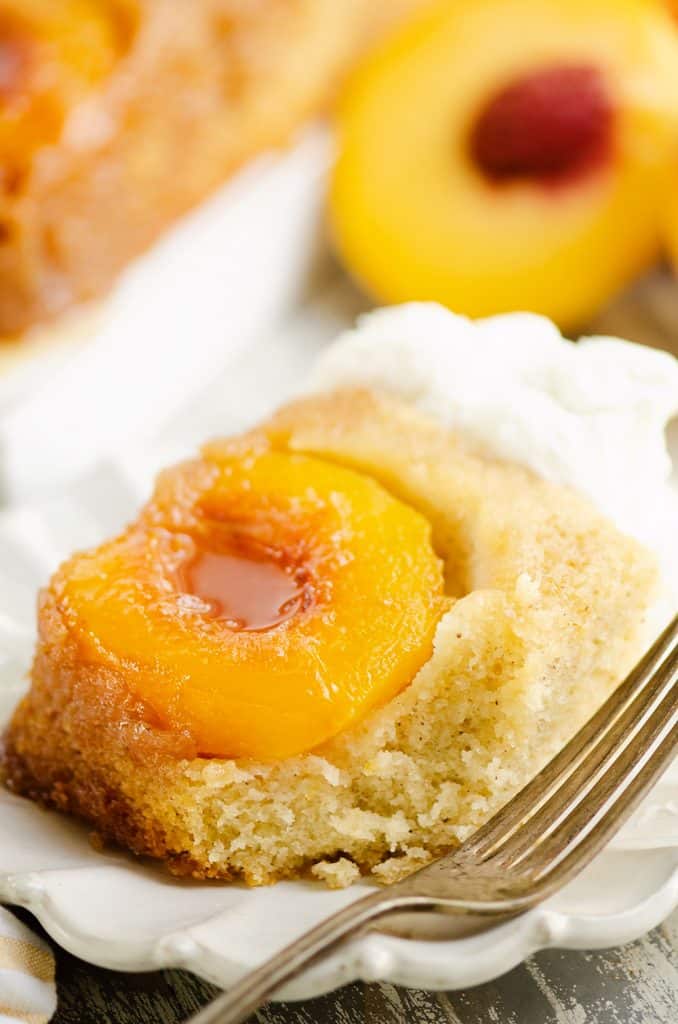 Peach Upside Down Cake on white plate with fork
