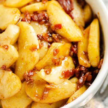 Caramelized Bacon & Apples in white bowl with fork