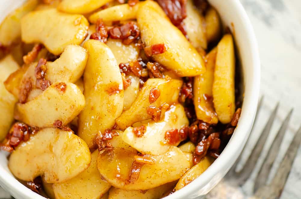 Caramelized Bacon & Apples in white bowl with fork