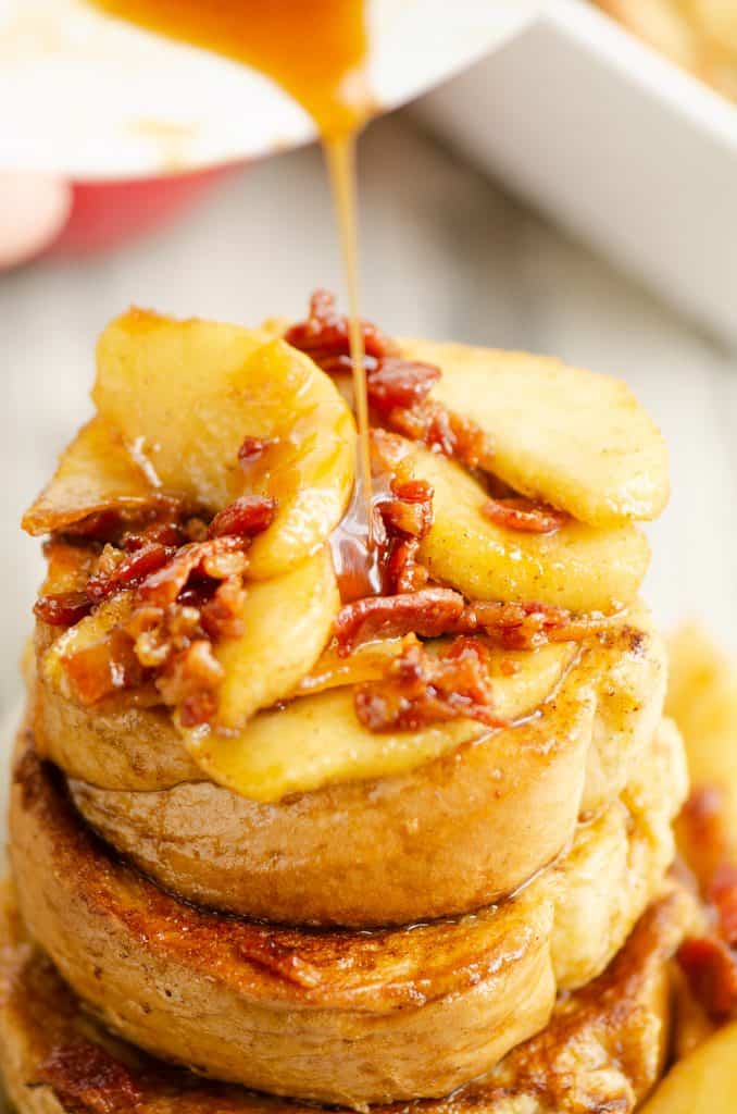Caramelized Bacon & Apples on top of French toast with caramel drizzled from bowl