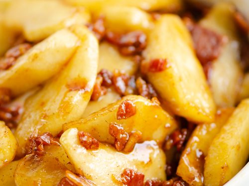 Caramelized Bacon & Apples in white bowl on table