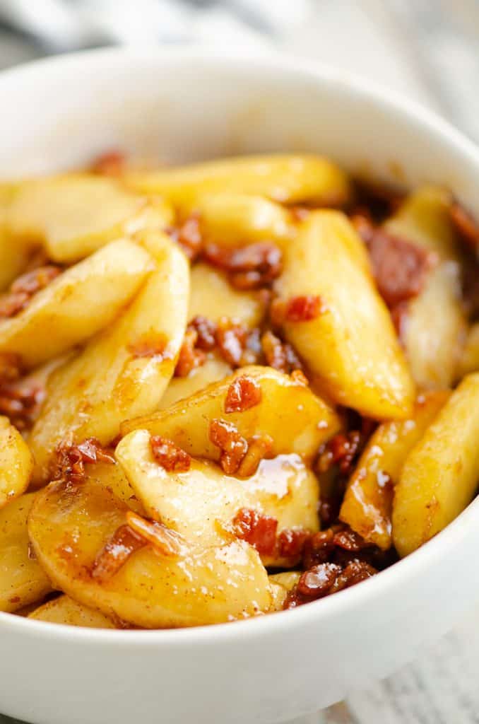 Caramelized Bacon & Apples in white bowl on table