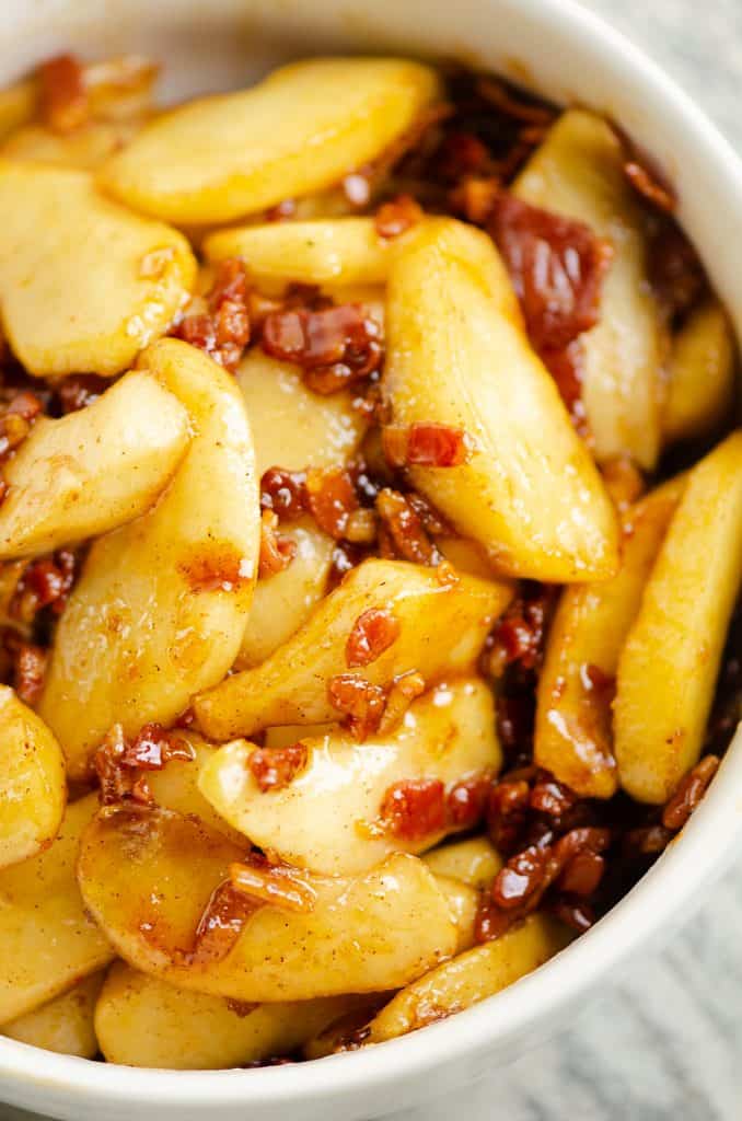 Caramelized Bacon & Apples in white bowl on table