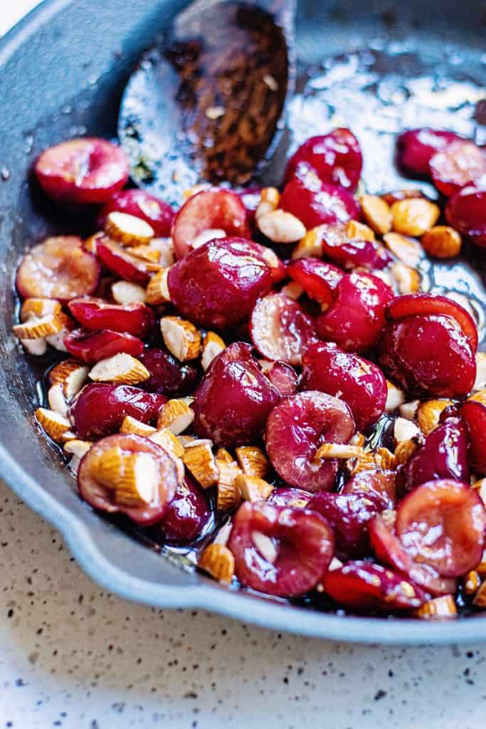 Cherries and almonds in cast iron skillet