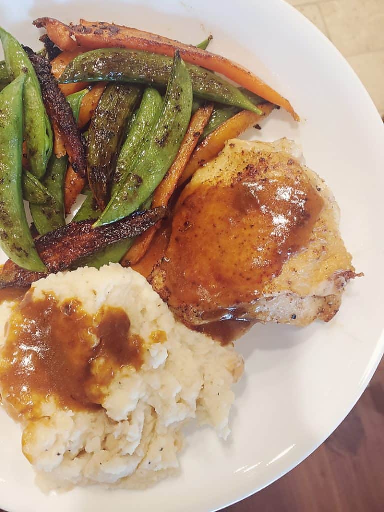 Gobble Chicken au Poivre with mashed potatoes and vegetables on plate