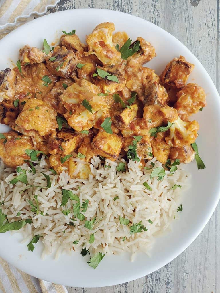 Gobble Paneer Cauliflower Tikka Masala and rice on white plate