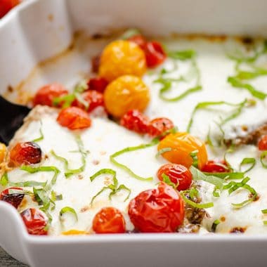 Honey Balsamic Caprese Chicken in white baking dish