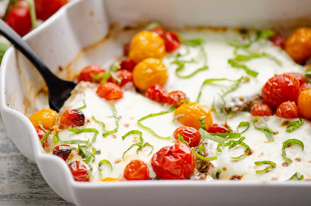 Honey Balsamic Caprese Chicken in white baking dish