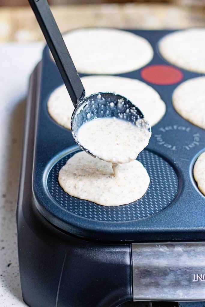 Oatmeal Pancakes spooned onto griddle