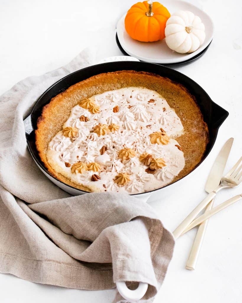 Pumpkin Spicy Dutch Baby in wite cast iron skillet