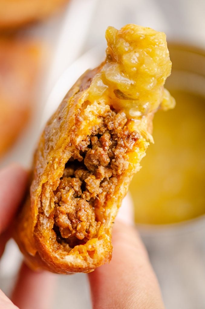 Air Fryer Taco Calzones dipped in salsa verde