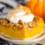 Pumpkin Pecan Custard Pie Bars on plate with whipped cream