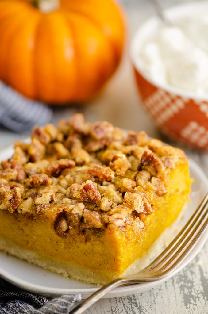 Pumpkin Pecan Custard Pie Bar on plate with fork