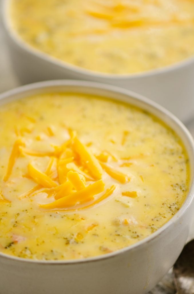 Pressure Cooker Cheesy Ham & Broccoli Soup in white bowl with spoon