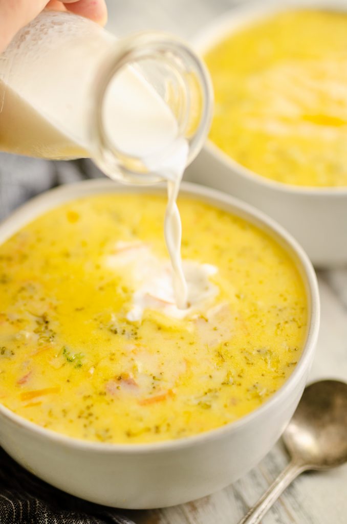 Pressure Cooker Cheesy Ham & Broccoli Soup with milk poured into bowl