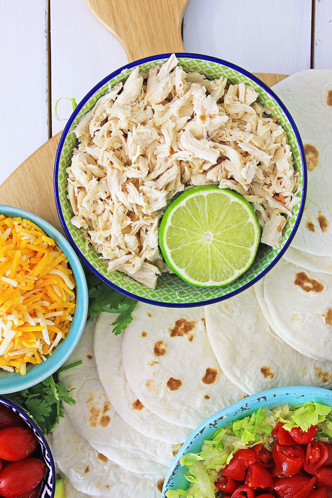 Pressure Cooker Chili Lime Chicken Taco meat with a lime