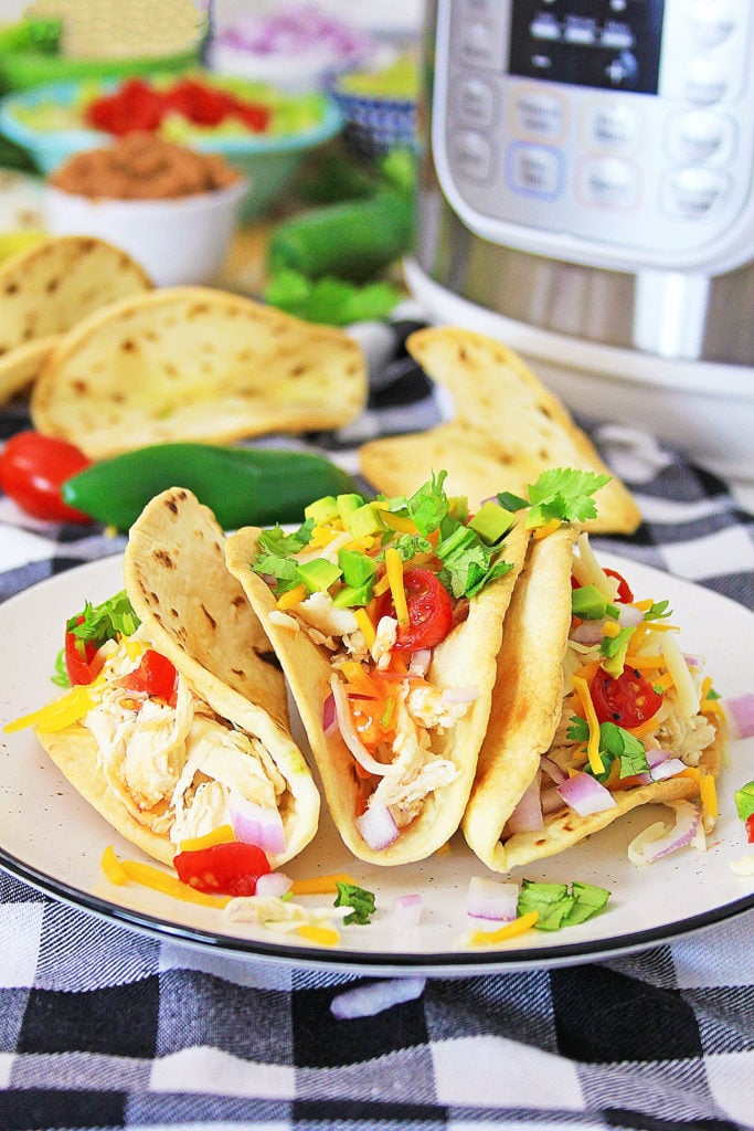 Pressure Cooker Chili Lime Chicken Tacos on table with Instant Pot