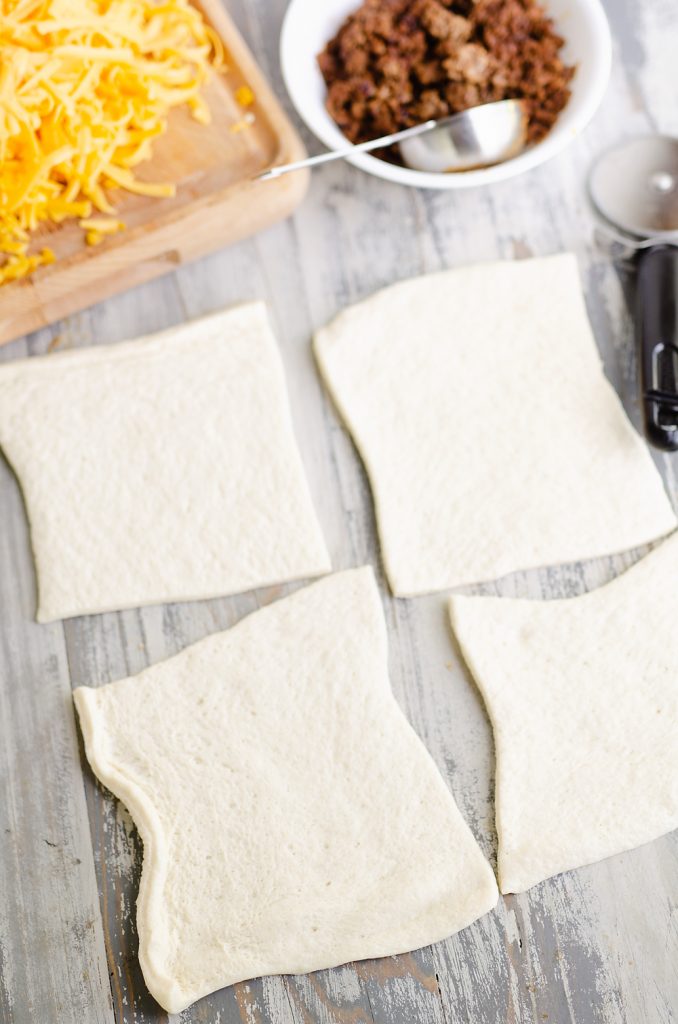 dividing store bought pizza crust into 4 pieces for calzones