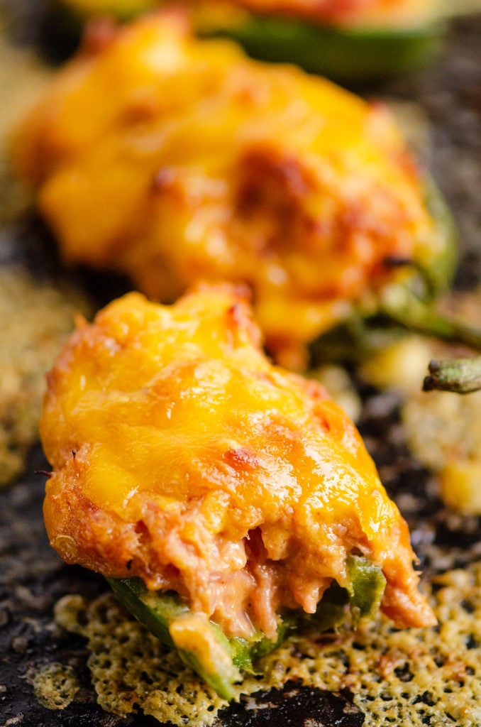 Cheesy BBQ Pork Jalapeno Poppers with bite out of front