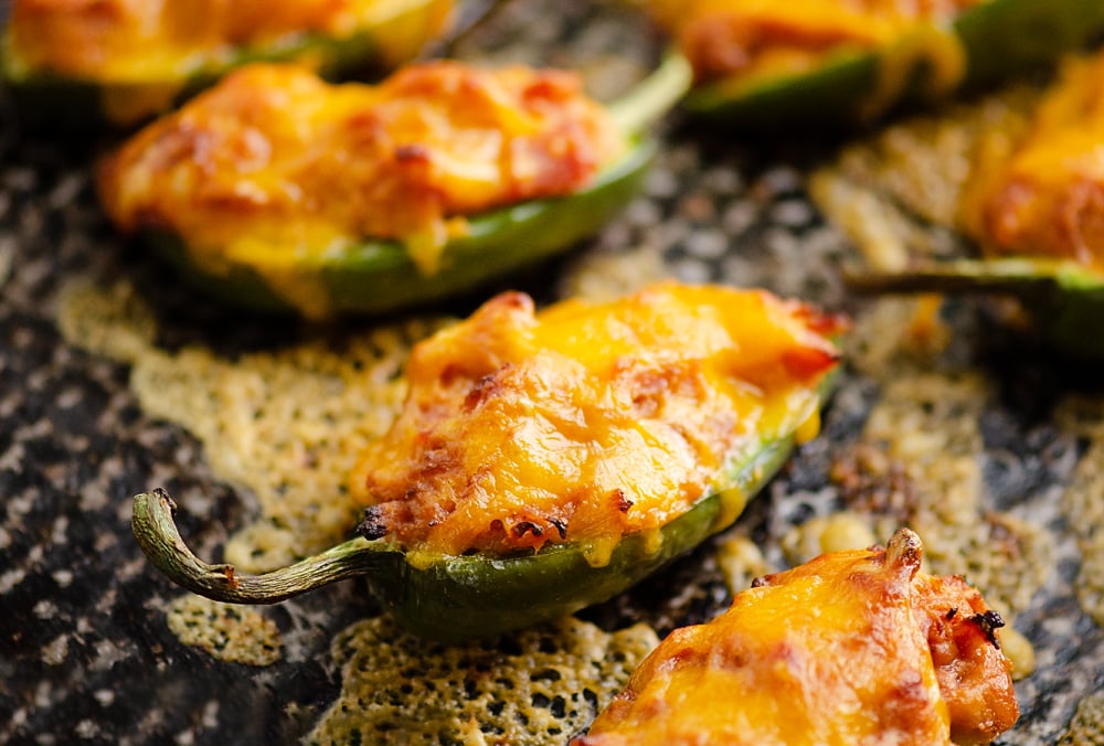 Cheesy BBQ Pork Jalapeno Poppers baked with cheese on sheet pan