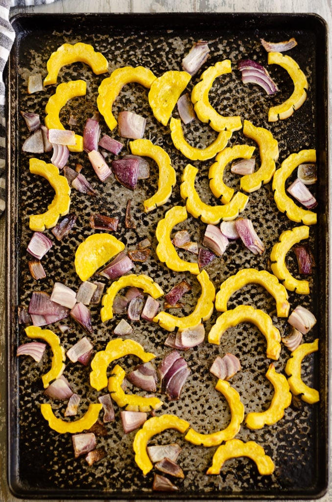 Roasted Delicata Squash and onions on sheet pan