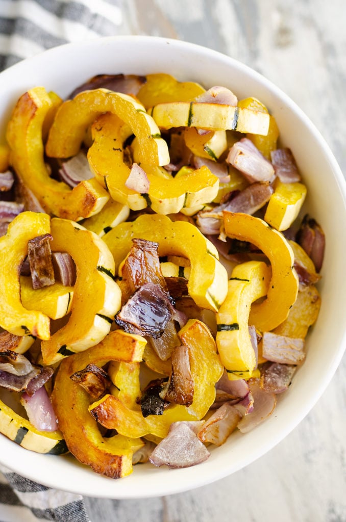 Roasted Delicata Squash and onions in bowl