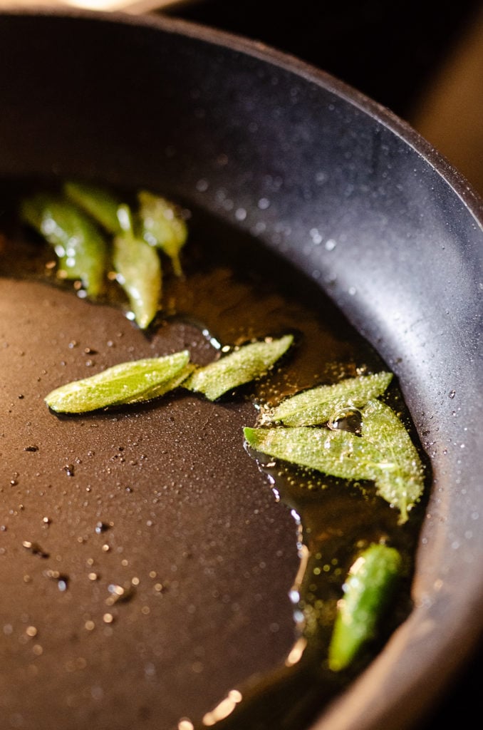 sage leaves fried in oil in pan