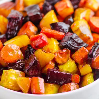 Honey Roasted Beets & Carrots in white bowl on table